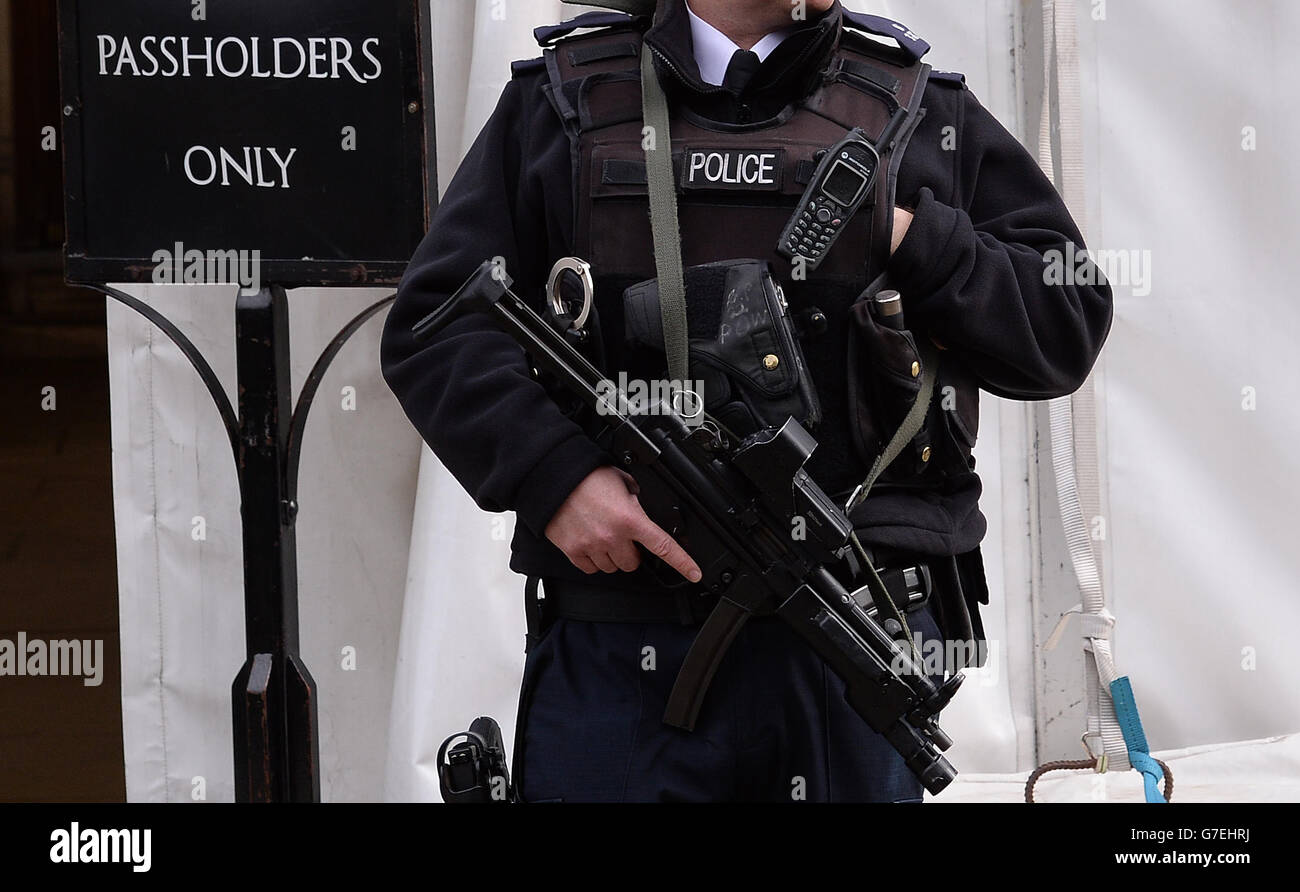 An armed Metropolitan police officer outside the Houses of Parliament ...