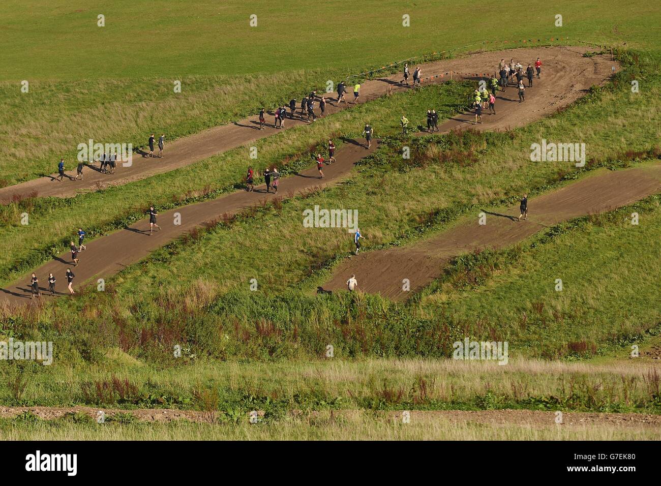 Participants take on Tough Mudder London South at The Matterley Bowl in Winchester, Hampshire. Stock Photo