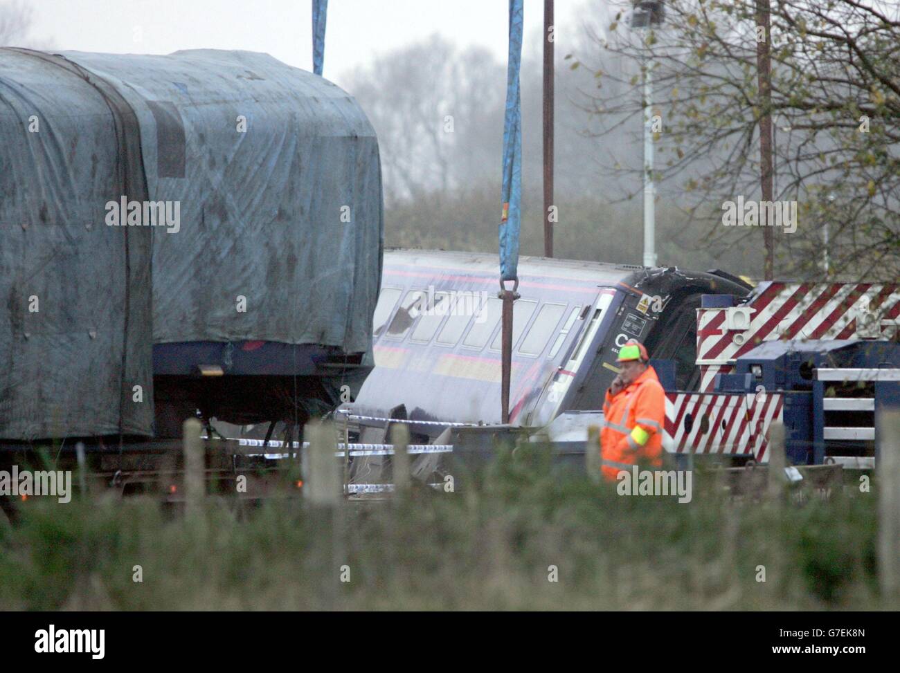 The scene at the train crash site at Ufton Nervet in Berkshire. A section of the train is being placed on to a low loader lorry to be taken away for examination. Stock Photo