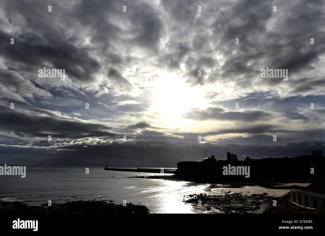 Menacing clouds hover over King Edward's Bay, near Tynemouth Priory in Northumberland. Stock Photo