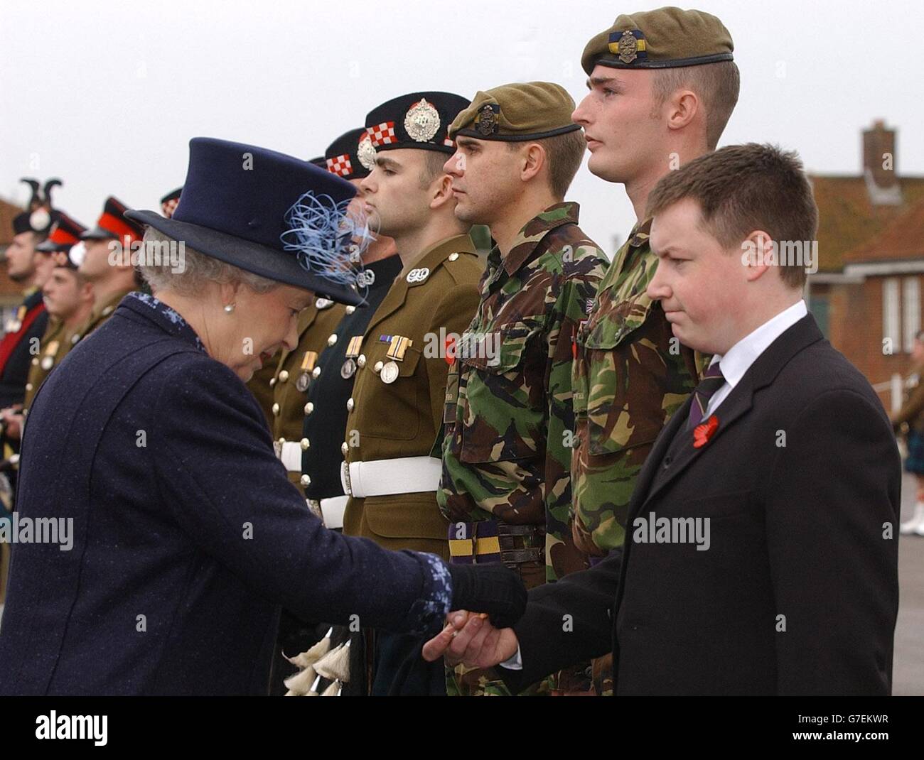 Queen Elizabeth II presents an Iraq campaign medal to Lance Corporal Gary Hannah at Howe Barracks in Canterbury, Kent where she also presented the 1st Battalion of The Argyll and Sutherland Highlanders with the Wilkinson Sword of Peace for establishing good relations with communities during their service in Iraq. Stock Photo