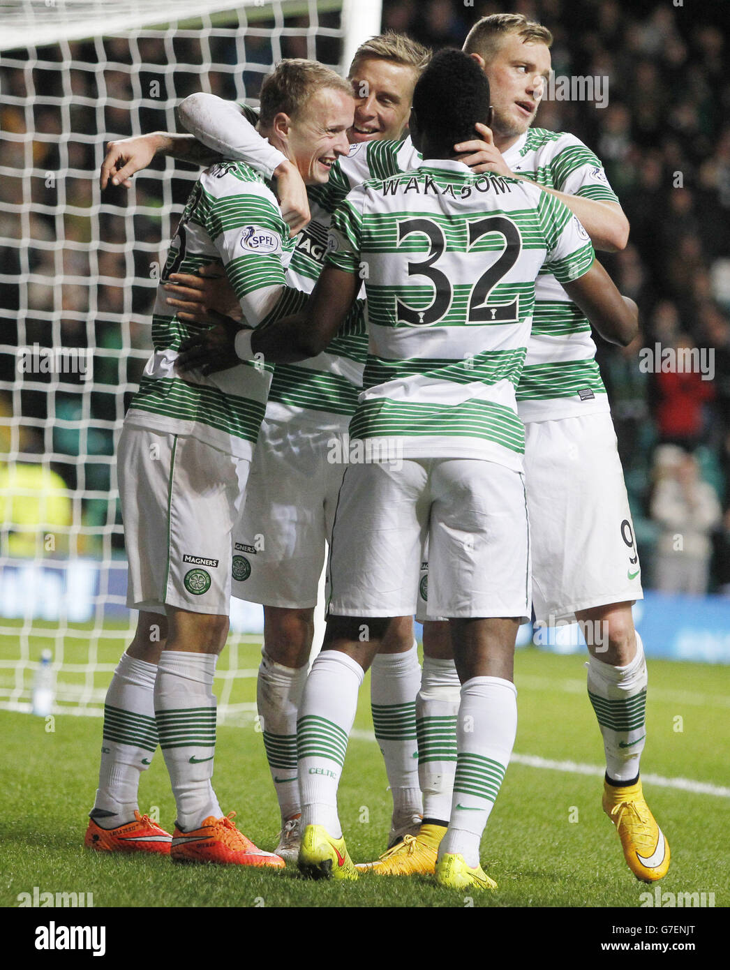 Celtic's Leigh Griffiths (left) celebrates his fist goal with team-mates Mubarak Wakaso, John Guidetti and Stefan Johansen during the Scottish League Cup Quarter Final match at Celtic Park, Glasgow. Stock Photo