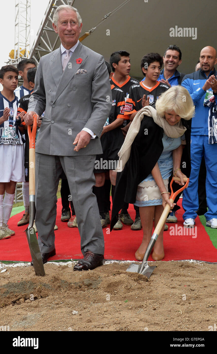 The Prince of Wales and The Duchess of Cornwall break ground on a new football pitch as they meet footballers from Pachuca Football as they visit the Escuela Publica Secundaria Magatzzi, (Secondary School) in Real del Monte, Mexico, on the sixth day of the Prince of Wales and Duchess of Cornwall's tour to Colombia and Mexico. PRESS i ASSOCIATION Photo. See PA Story: ROYAL Tour. Photo credit should read: Anthony Devlin/PA Wire Stock Photo
