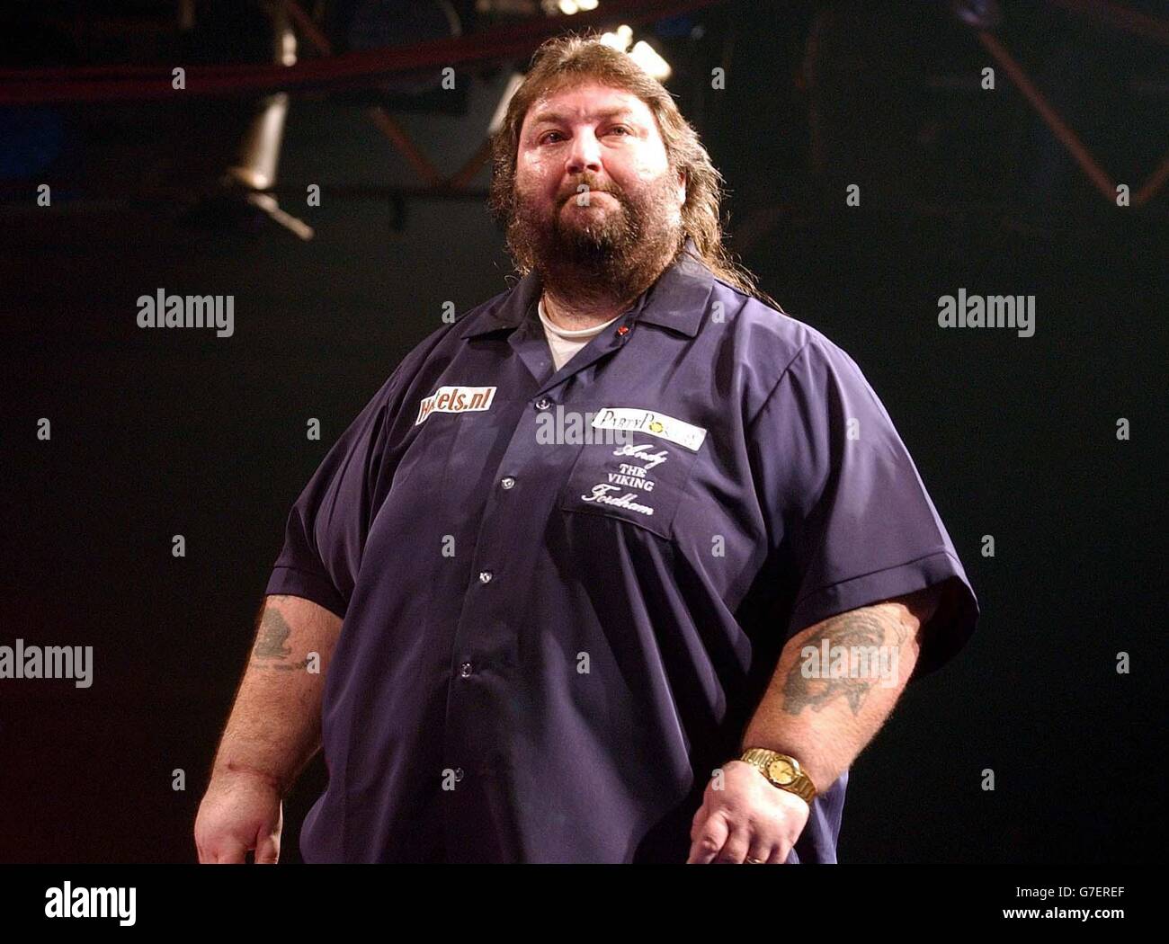 Andy Fordham during The Showdown against Phil Taylor at the Circus Tavern in Purfleet, Essex. Fordham later retired from the match suffering from heat exhaustion. Stock Photo