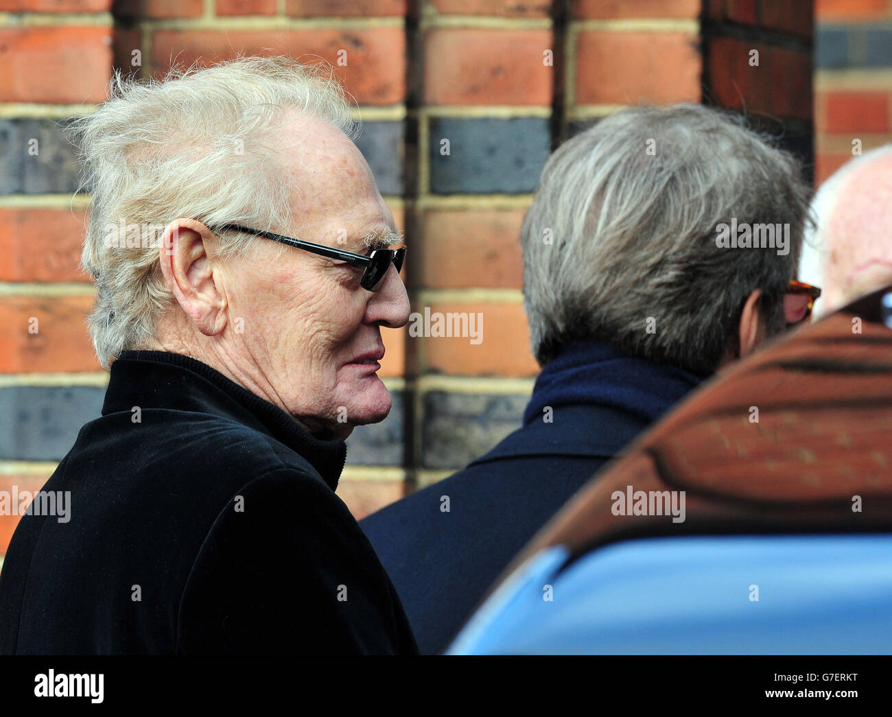 Ginger Baker and Eric Clapton (right)arrive for the funeral of Jack