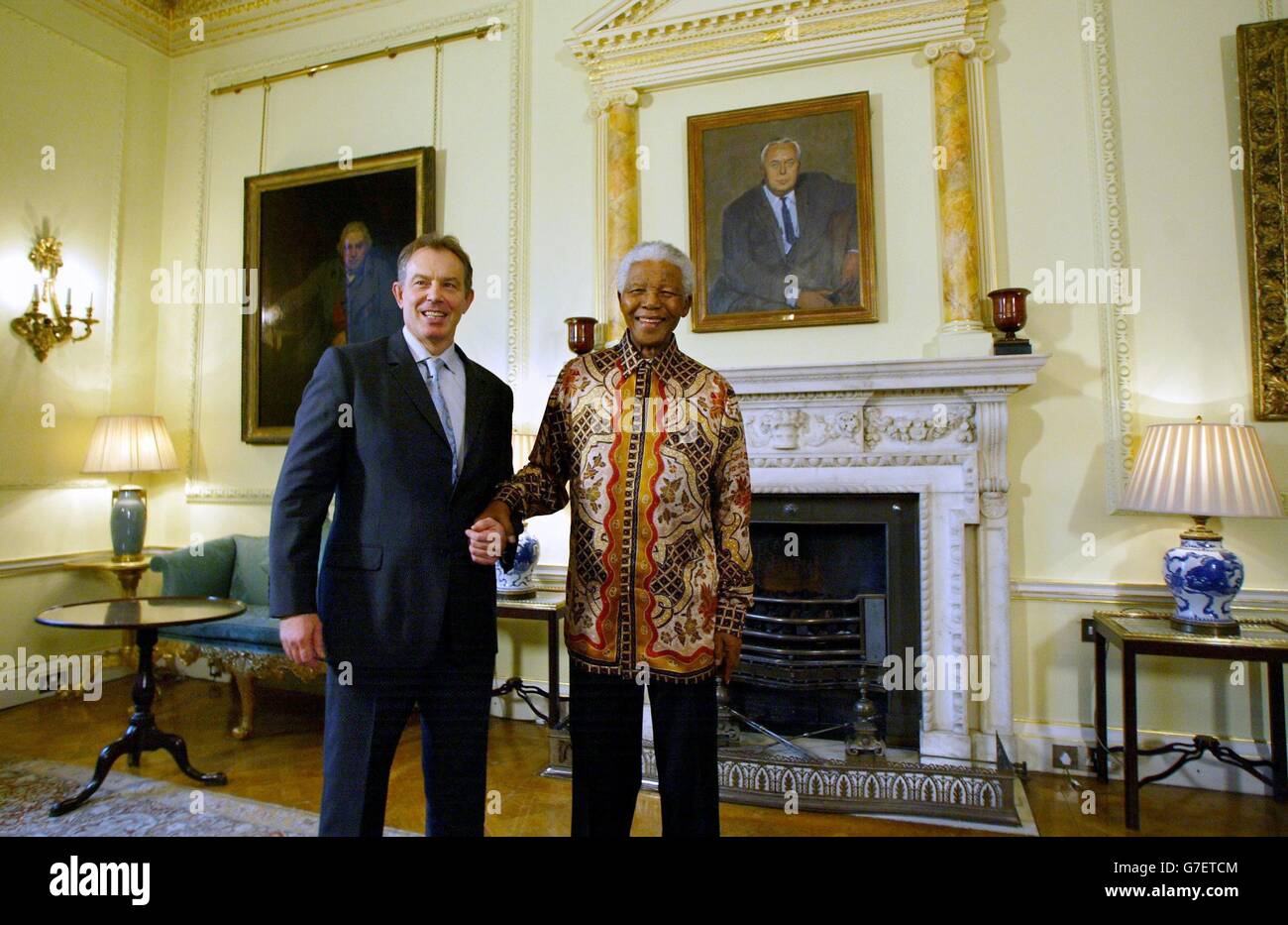 South Africa's former President Nelson Mandela (R) meets with British Prime Minister Tony Blair (L) at 10 Downing street in London 26 November 2004. See PA STORY POLITICS Mandela:PA photo NICOLAS ASFOURI /AFP WPA/POOL Stock Photo