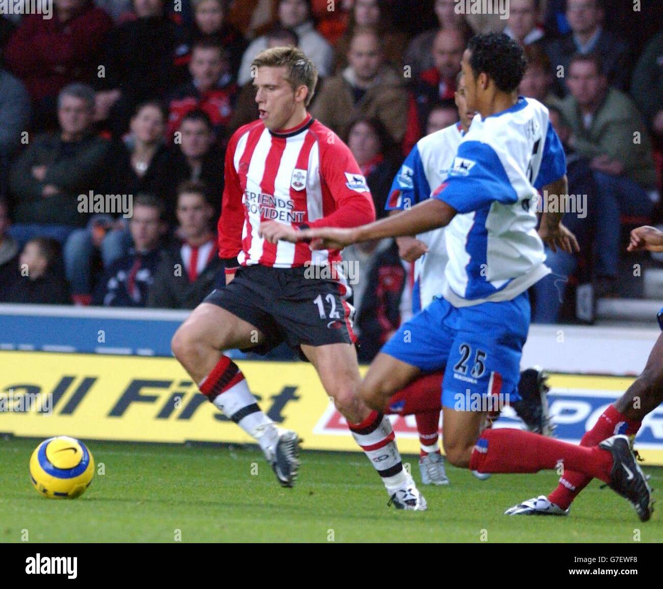 Southampton's Anders Svensson (left) tries to avoid the tackle of Crystal Palace's Fitz Hall during the Barclays Premiership match at St Mary's Stadium, Southampton, Saturday November 27, 2004. Stock Photo