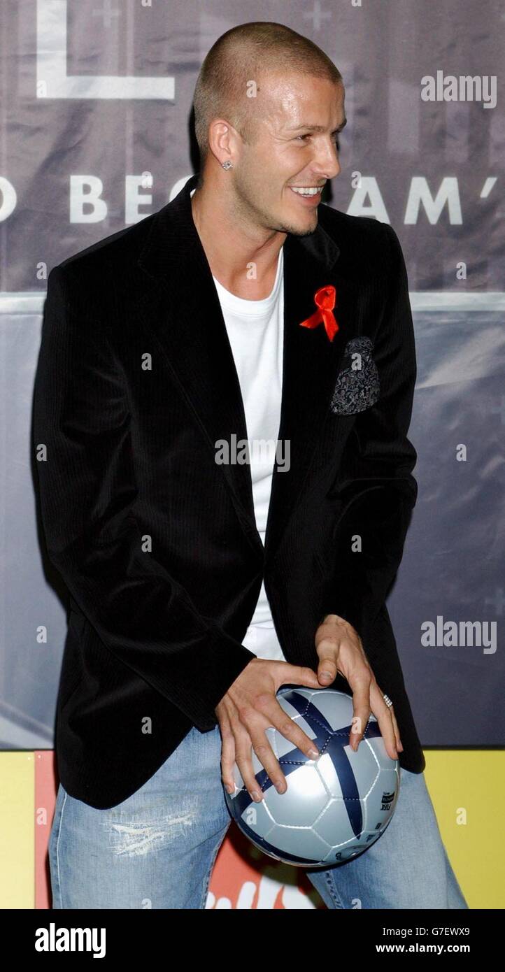 David Beckham shows off his football skills, during an in-store appearance at Virgin Megastore on Oxford Street, central London, to sign copies of his official training skills DVD, 'Really Bend It Like Beckham'. Stock Photo