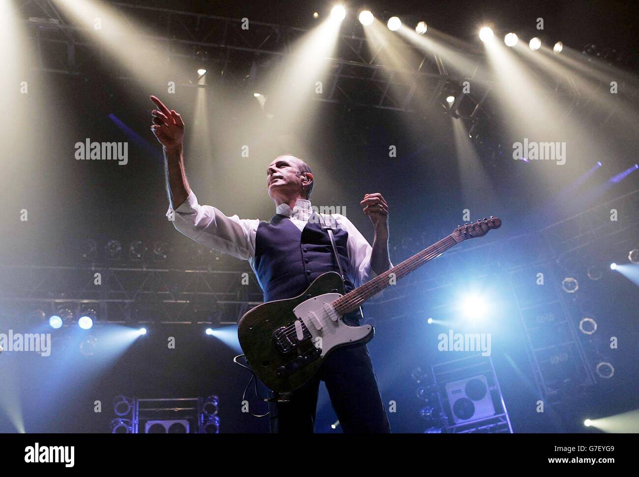 Guitarist Francis Rossi from the rock group Status Quo on stage, during their concert at Wembley Arena in London. Stock Photo
