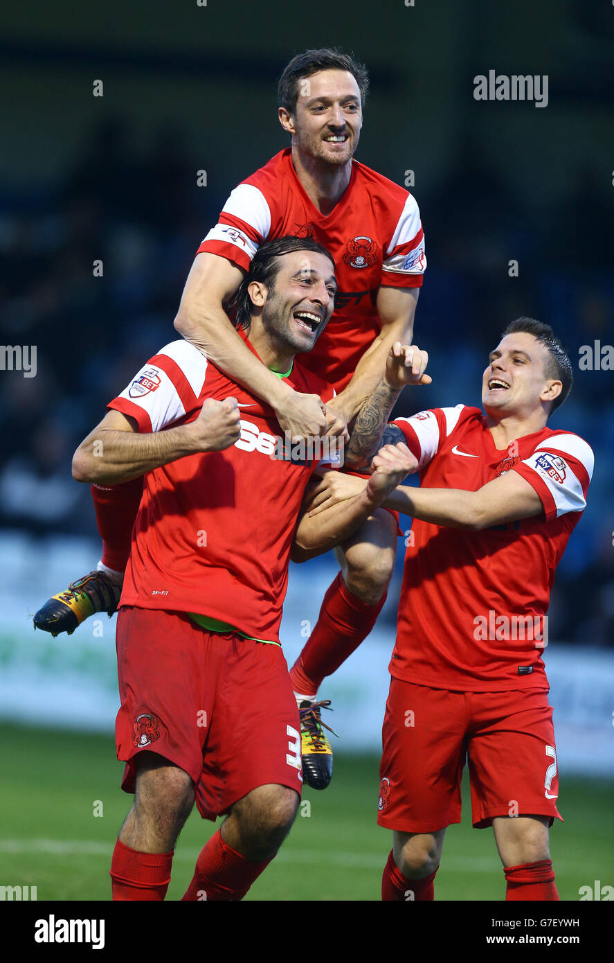 Leyton Orient's Gianvito Plasmati is congratulated by David Mooney (top) and Dean Cox (right) after scoring his teams opening goal during the Sky Bet League One match at the Priestfield Stadium, Gillingham. Stock Photo