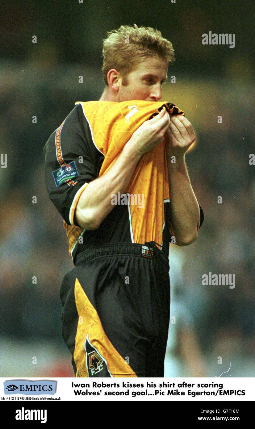 Iwan Roberts kisses his shirt after scoring Wolves' second goal Stock Photo
