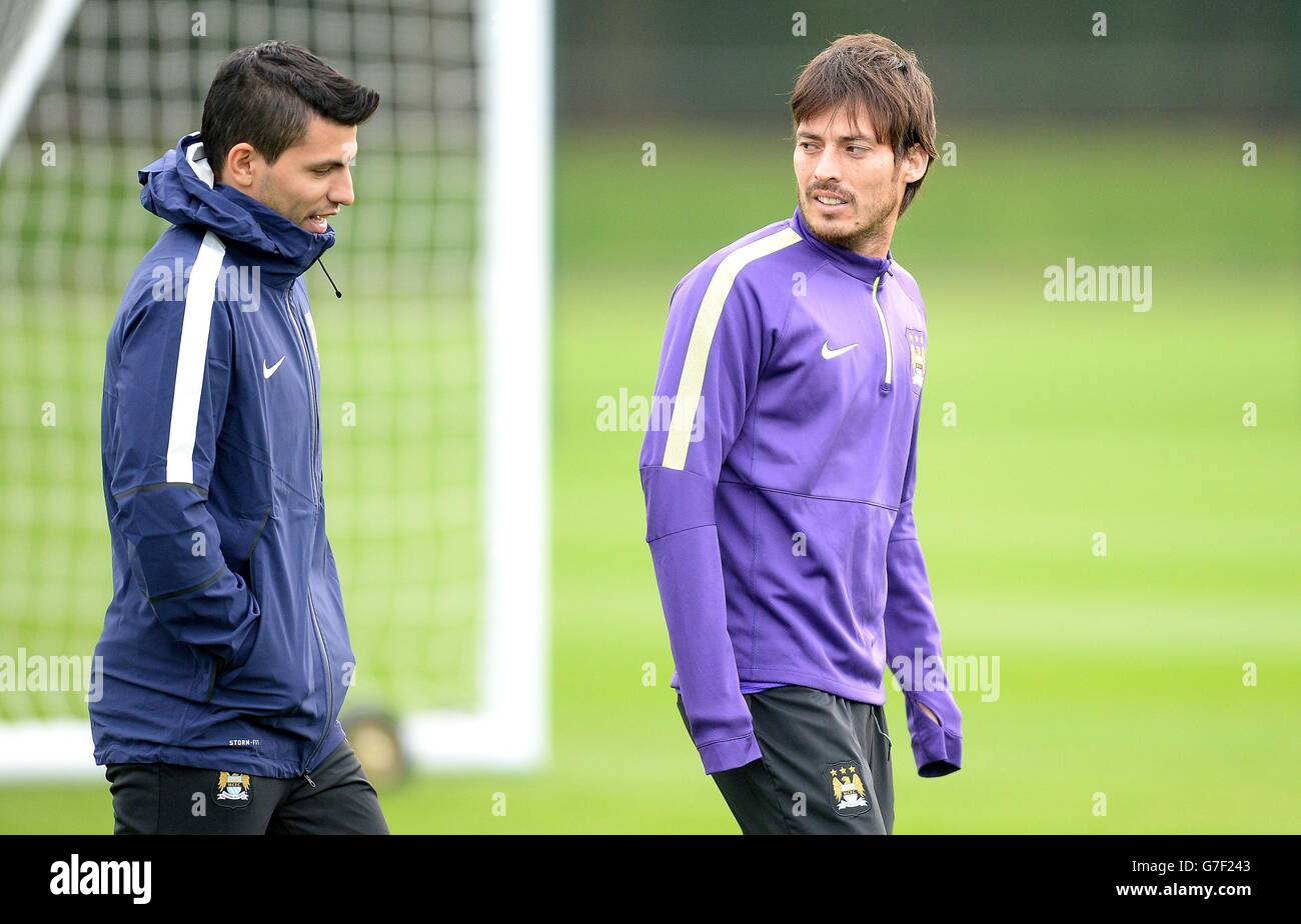 Manchester City's Sergio Aguero (left) and David Silva leave a training session at City Football Academy, Manchester. Stock Photo