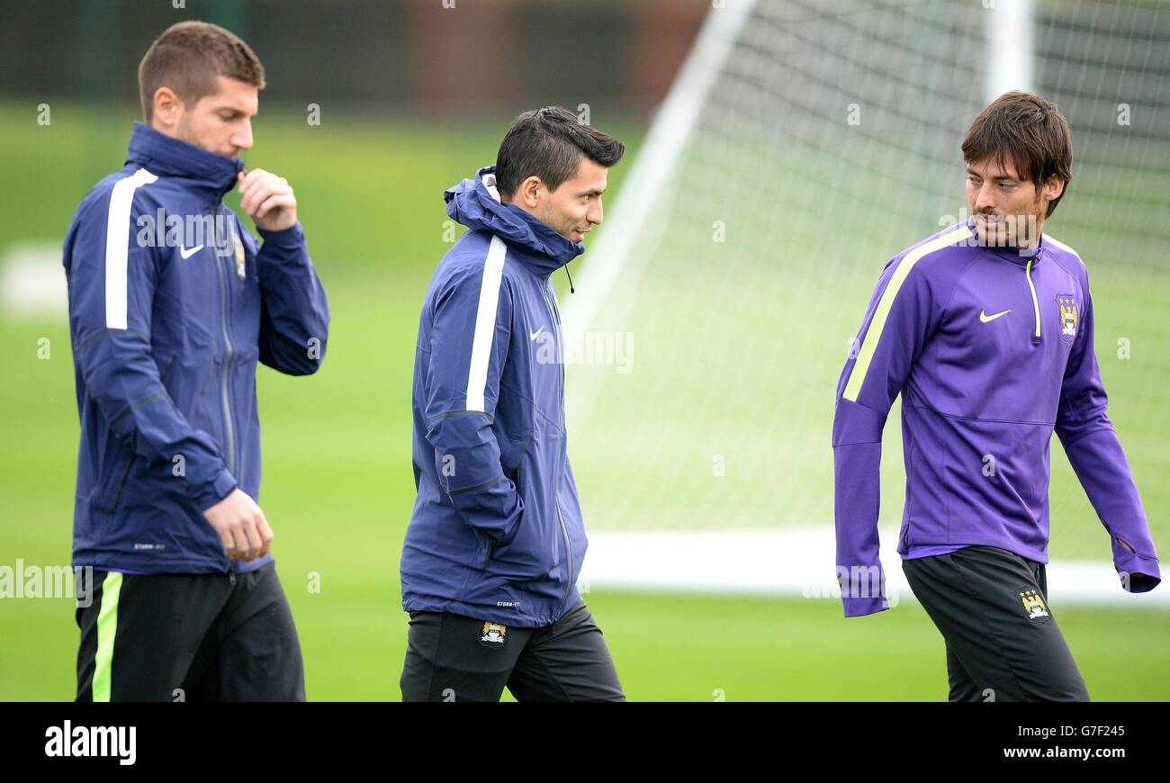 Manchester City's Sergio Aguero (centre), David Silva (right) and Matija Nastasic (left) leave a training session during a training session at City Football Academy, Manchester. Stock Photo