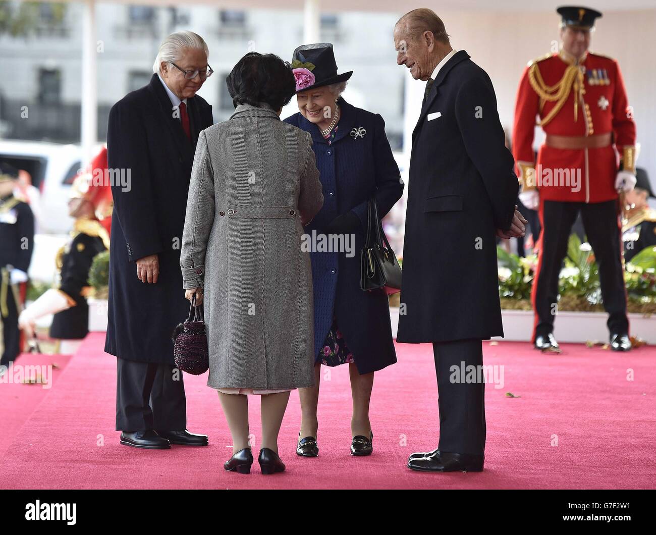 Queen Elizabeth II and the Duke of Edinburgh (right) greet the President of Singapore Tony Tan Keng Yam (left) and his wife Mary Chee (left) during a ceremonial welcome at Horse Guards Parade in London on the first of a four day state visit to the Britain. Stock Photo