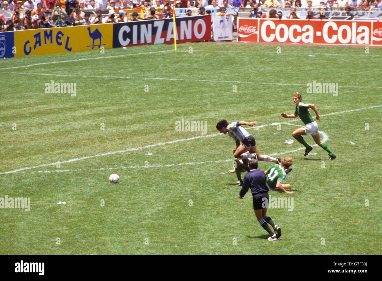Sequence shot of Argentina's Diego Maradona being fouled by West Germany's Ditmar Jakobs (17) as he burst through on goal. Stock Photo