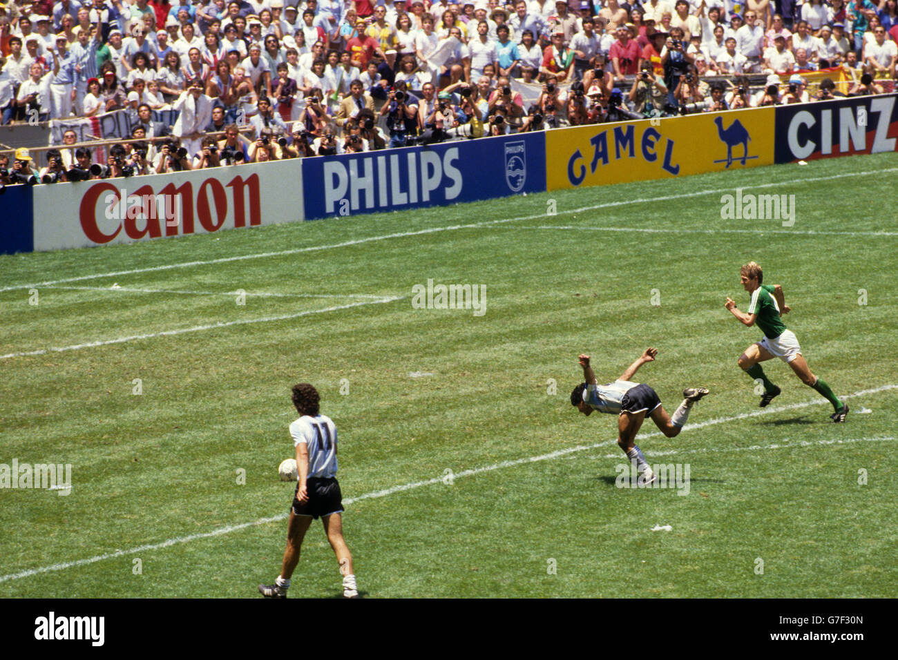 Sequence shot of Argentina's Diego Maradona being fouled by West Germany's Ditmar Jakobs (not in frame) as he burst through on goal. Stock Photo