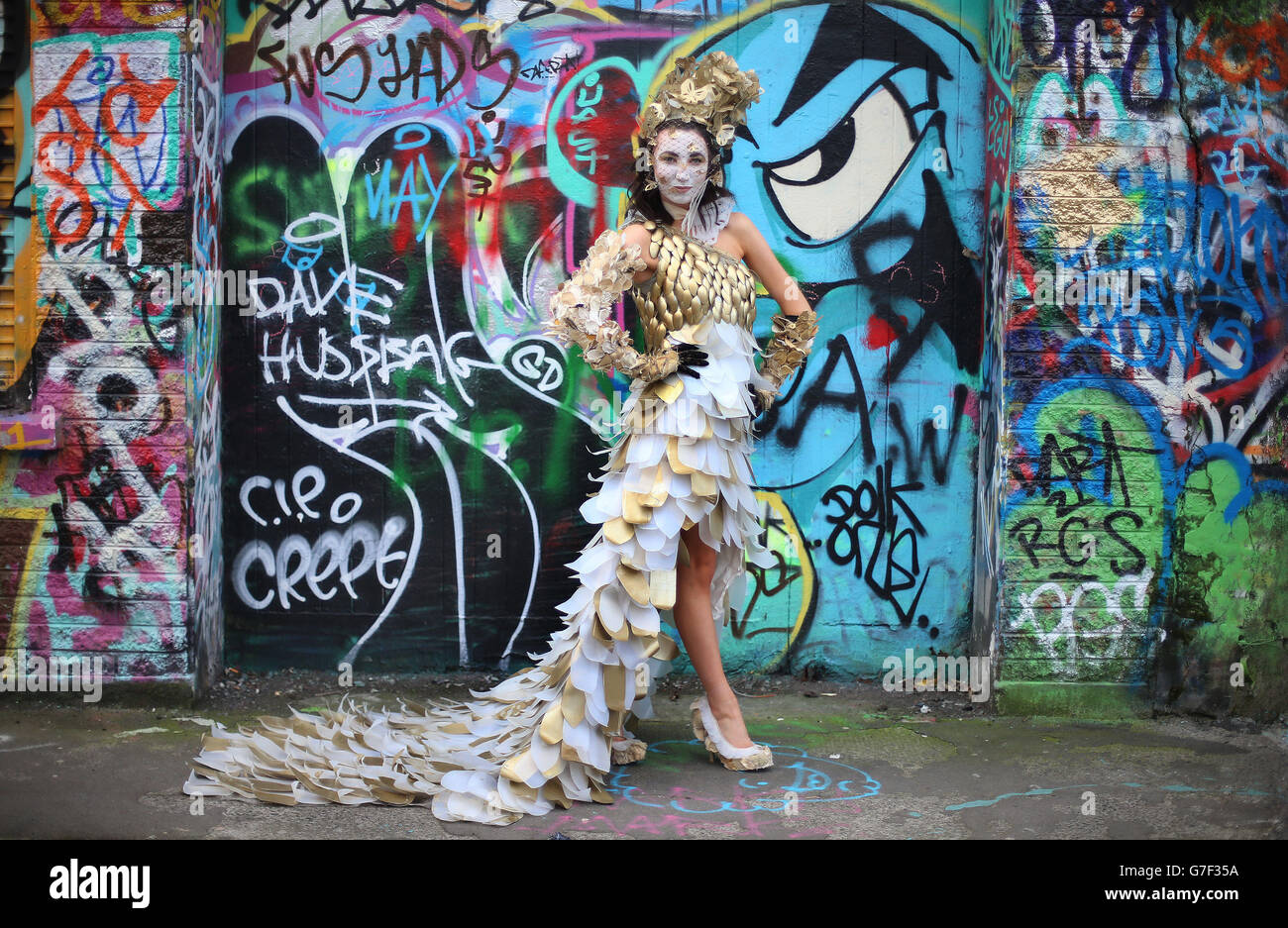 Leona Sheman from Cork, a finalist from last year's Bank of Ireland, Junk Kouture Recycled Fashion Competition poses in an outfit entitled Papillion d'Or in Windmill Lane, Dublin. The outfit is made from 453 milk cartons, plastic spoons, old fabric and copper wire. The organisers are looking for entries for this year's competition. Stock Photo
