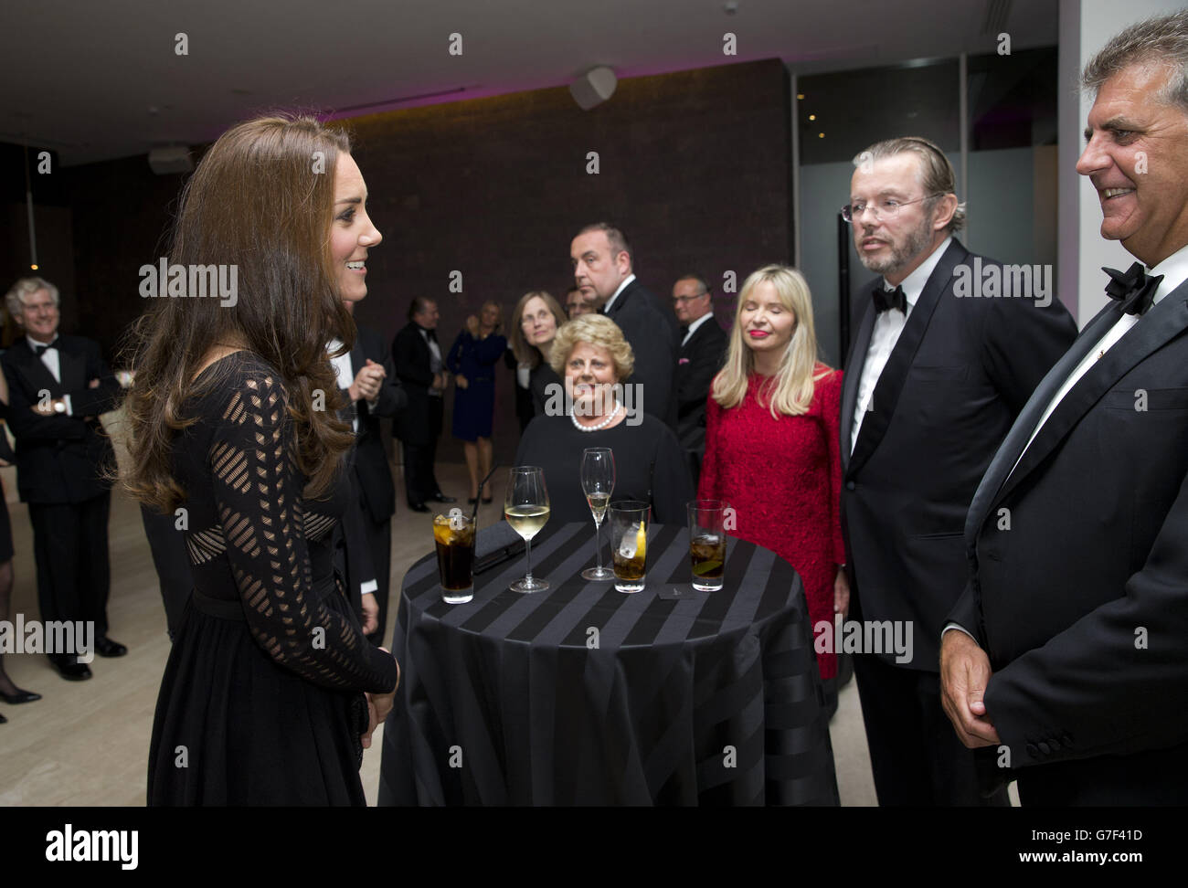The Duchess of Cambridge (left) greets supporters, including Han Rausing (second right) and his wife Julia Delves Broughton (centre) as she attends an Autumn Gala evening in support of Action on Addiction. Stock Photo