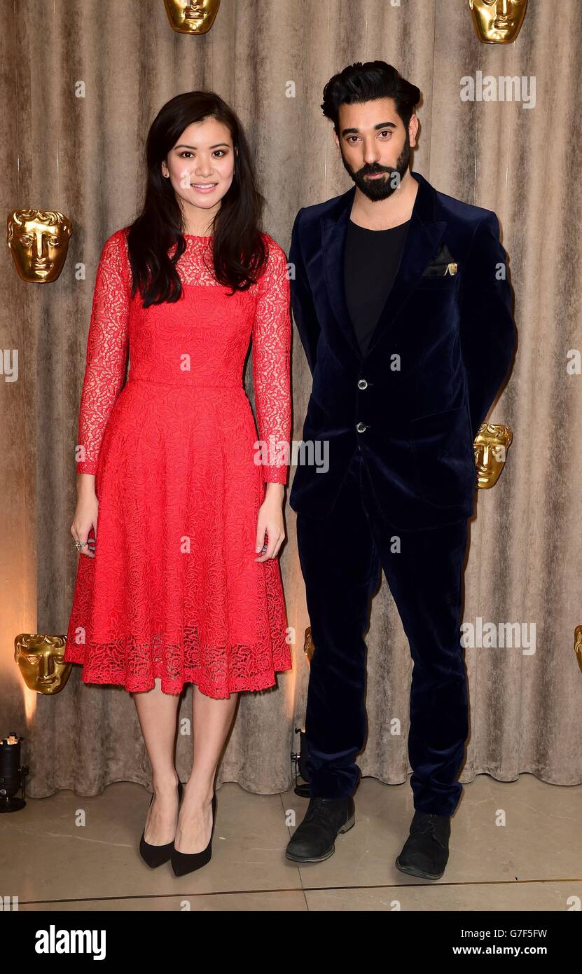 Katie Leung and Ray Panthaki attending the BAFTA Breakthrough Brits 2014 launch at Burberry in, London. Stock Photo