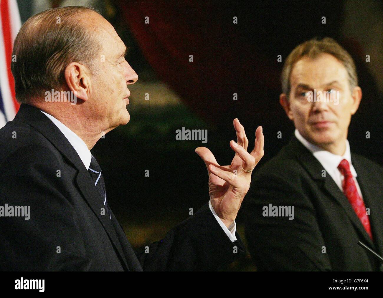French President Jacques Chirac (left) gestures as British Prime Minister Tony Blair looks on during the 27th UK-France Summit at Lancaster House in London. The summit comes at the end of the celebrations marking the centenary of the Entente Cordiale Treaty, which laid the foundations for a permanent alliance between the two countries. See PA story POLITICS Blair. PA Photo: AFP/Jim Watson/WPA POOL Stock Photo