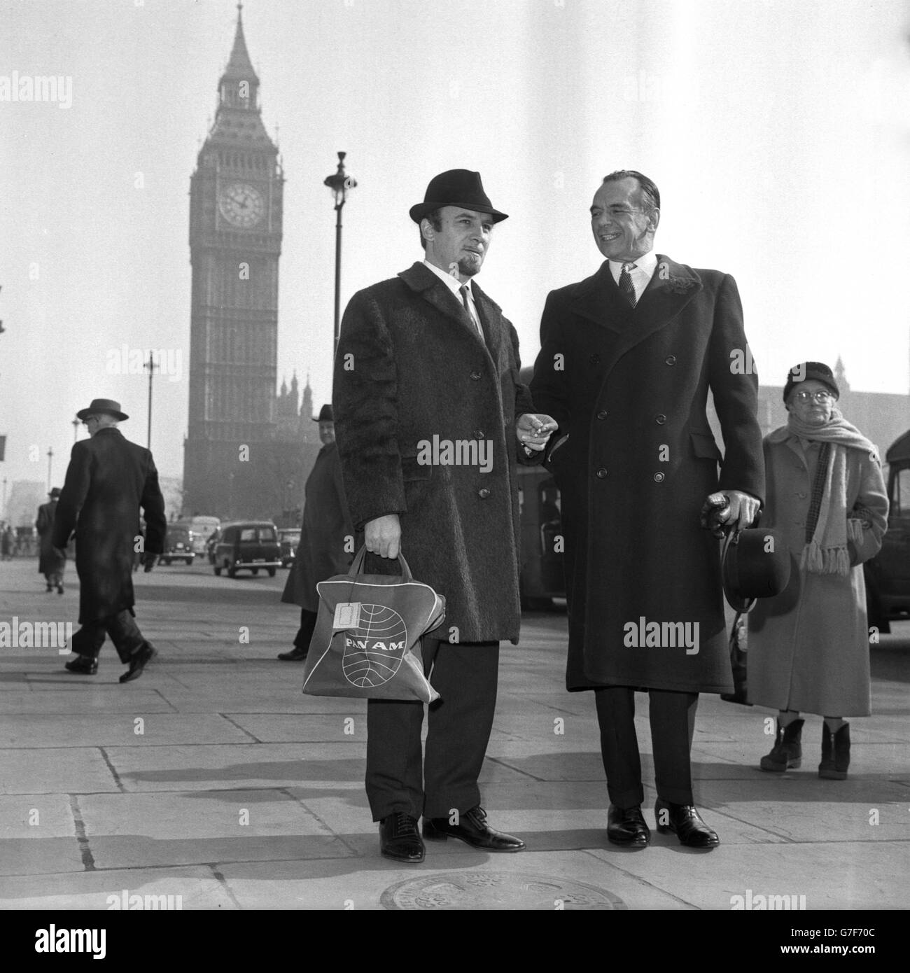 Jazz bandleader Acker Bilk (l) and orchestral conductor Sir Malcolm Sargent meet in the shadow of Big Ben at Westminster, London. they had just visited the Treasury as two members of a musicians' deputation seeking a reduction in the 25 per cent purchase tax on musical instruments. The deputation - led by Dr W. Greenhouse Allt, Principal of Trinity College of Music and President of the National Music Council of Great Britain - were received by Edward Du Cann, Economic Secretary to the Treasury. Stock Photo
