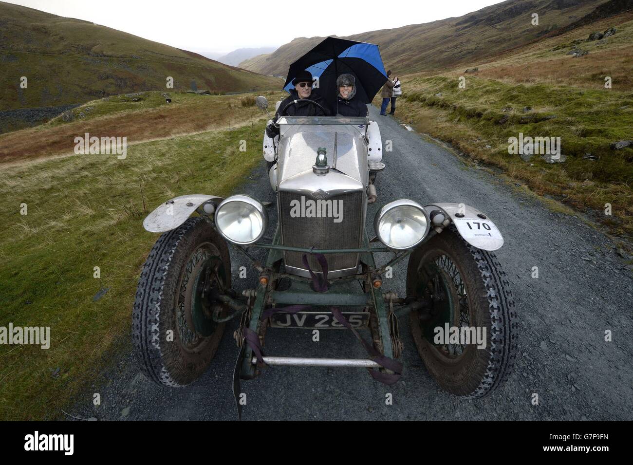 Christopher and Rachael Williams with there Riley Special 1930, as vintage cars climb up iconic Lakeland mountain, winding their way more than 2,100 feet up one of England's steepest roads and past Honister Slate mine in Cumbria in the spectacular motoring event. Stock Photo