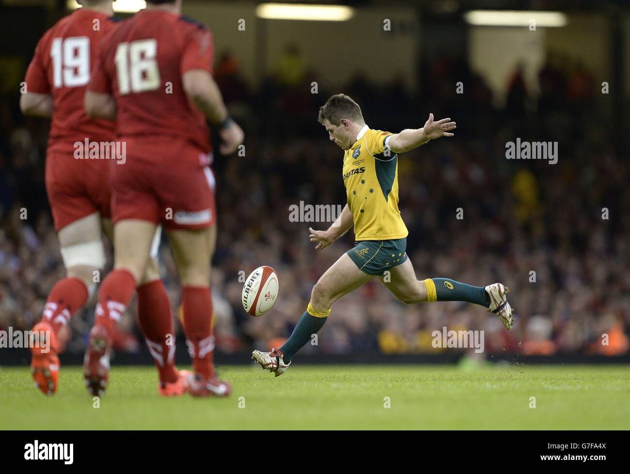 Australia's Bernard Foley (right) kicks a successful drop goal during ...