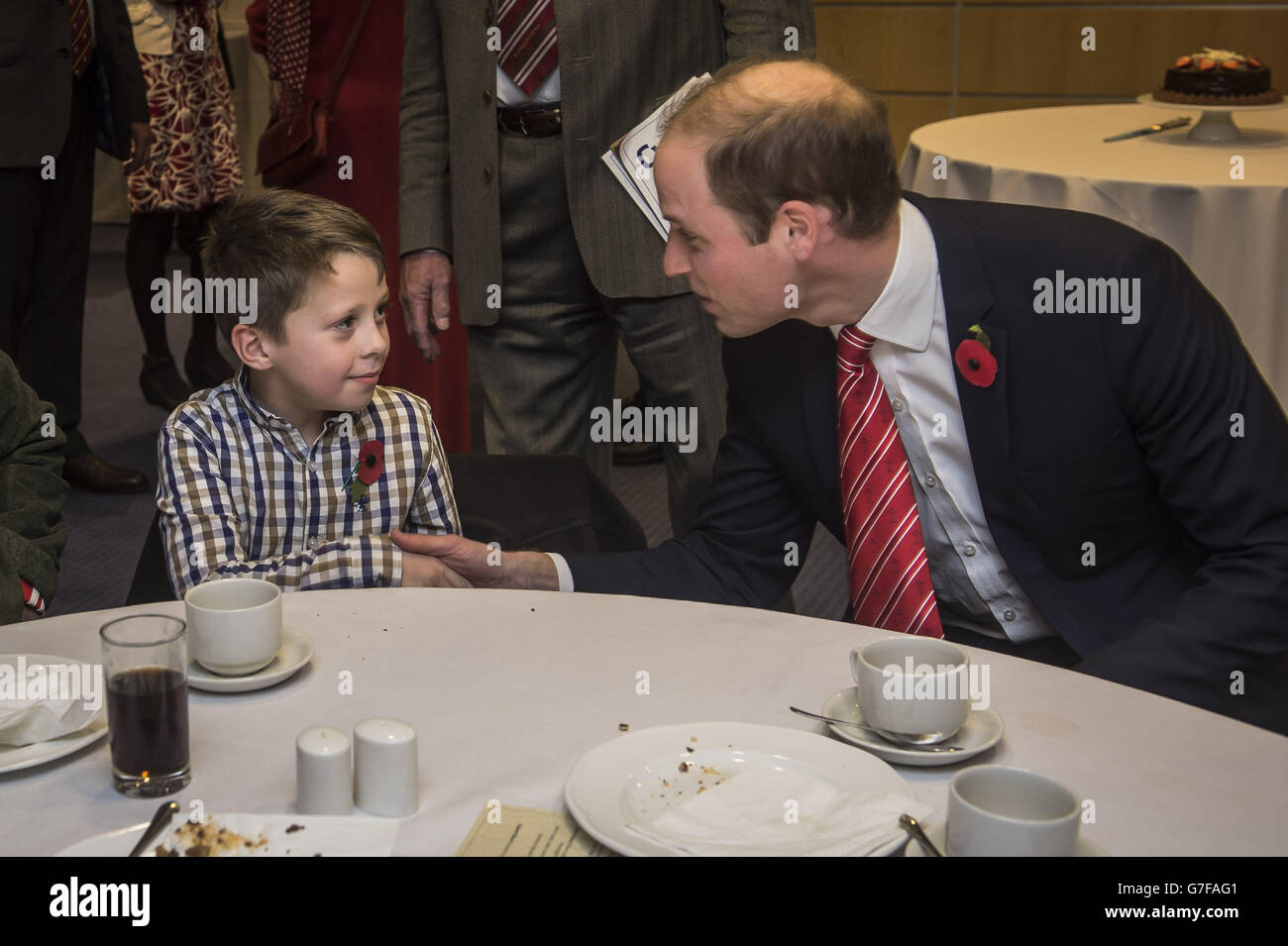 His Royal Highness the Duke of Cambridge meets Rhun Lewis, 8, from Newtown, at a reception at Millennium Stadium, Wales, after watching the international rugby match between Wales and Australia. Stock Photo