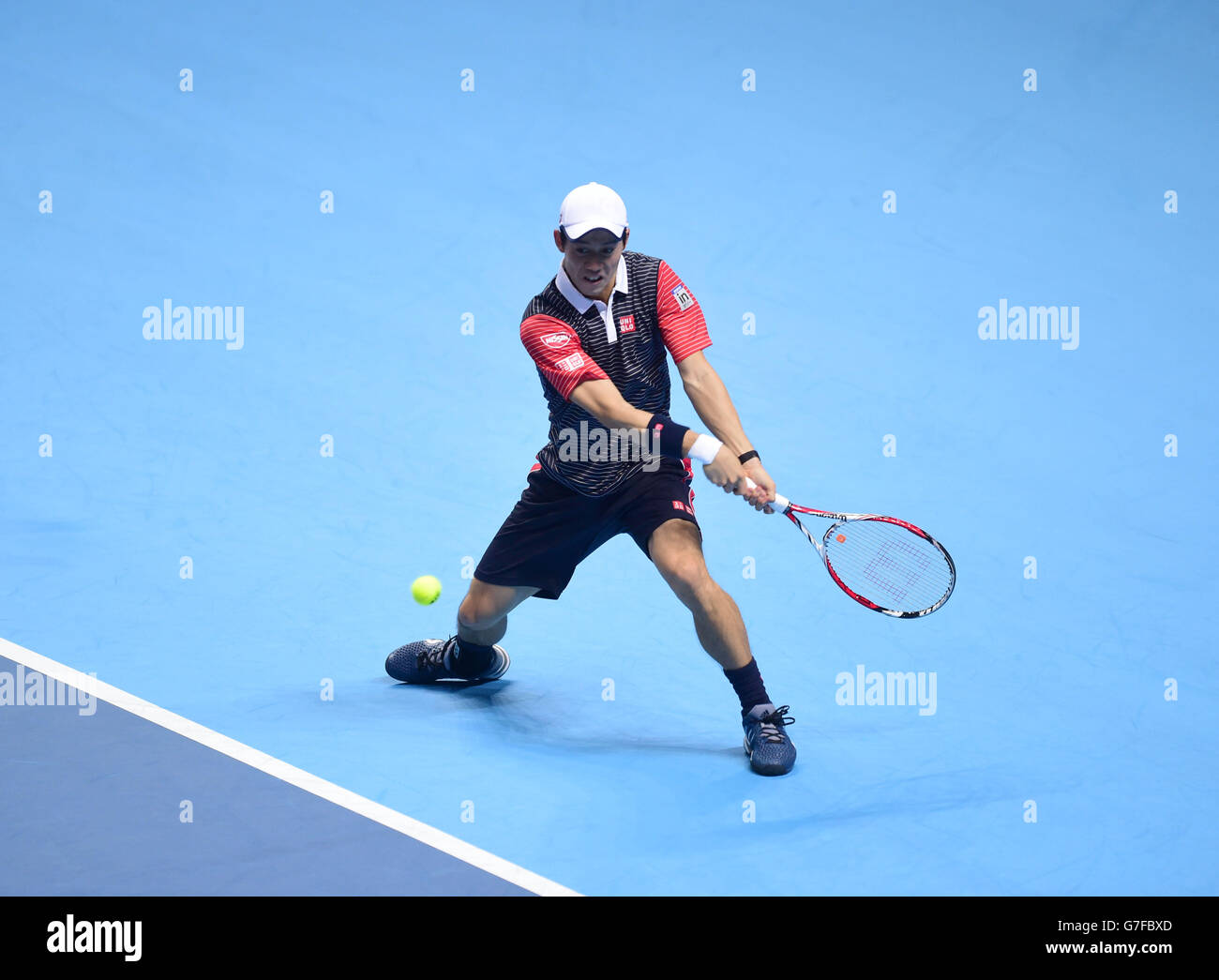 Japan's Kei Nishikori in action against Switzerland's Roger Federer during the Barclays ATP World Tour Finals at The O2 Arena, London. PRESS ASSOCIATION Photo. Picture date: Tuesday November 11, 2014. See PA story TENNIS London. Photo credit should read Adam Davy/PA Wire. Stock Photo