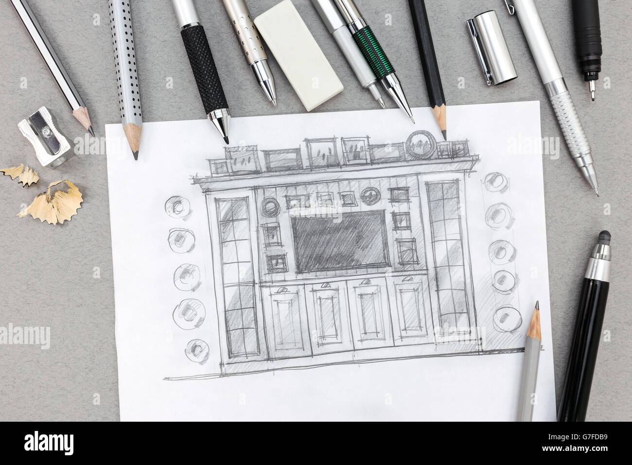 freehand sketch design of wall unit with pens and pencils on desk Stock Photo