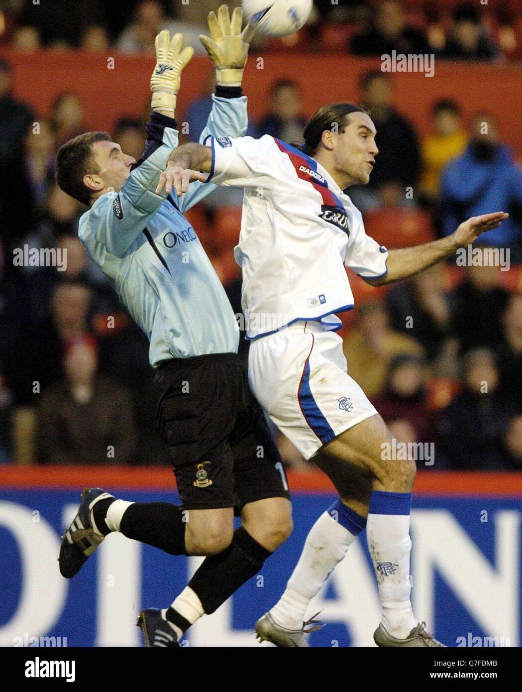 Rangers' Dado Prso challenges Inverness Caledonian Thistle goalkeeper Mark Brown during the Bank of Scotland Premier League match at Pittodrie, Aberdeen. FOR EDITORIAL USE ONLY Stock Photo