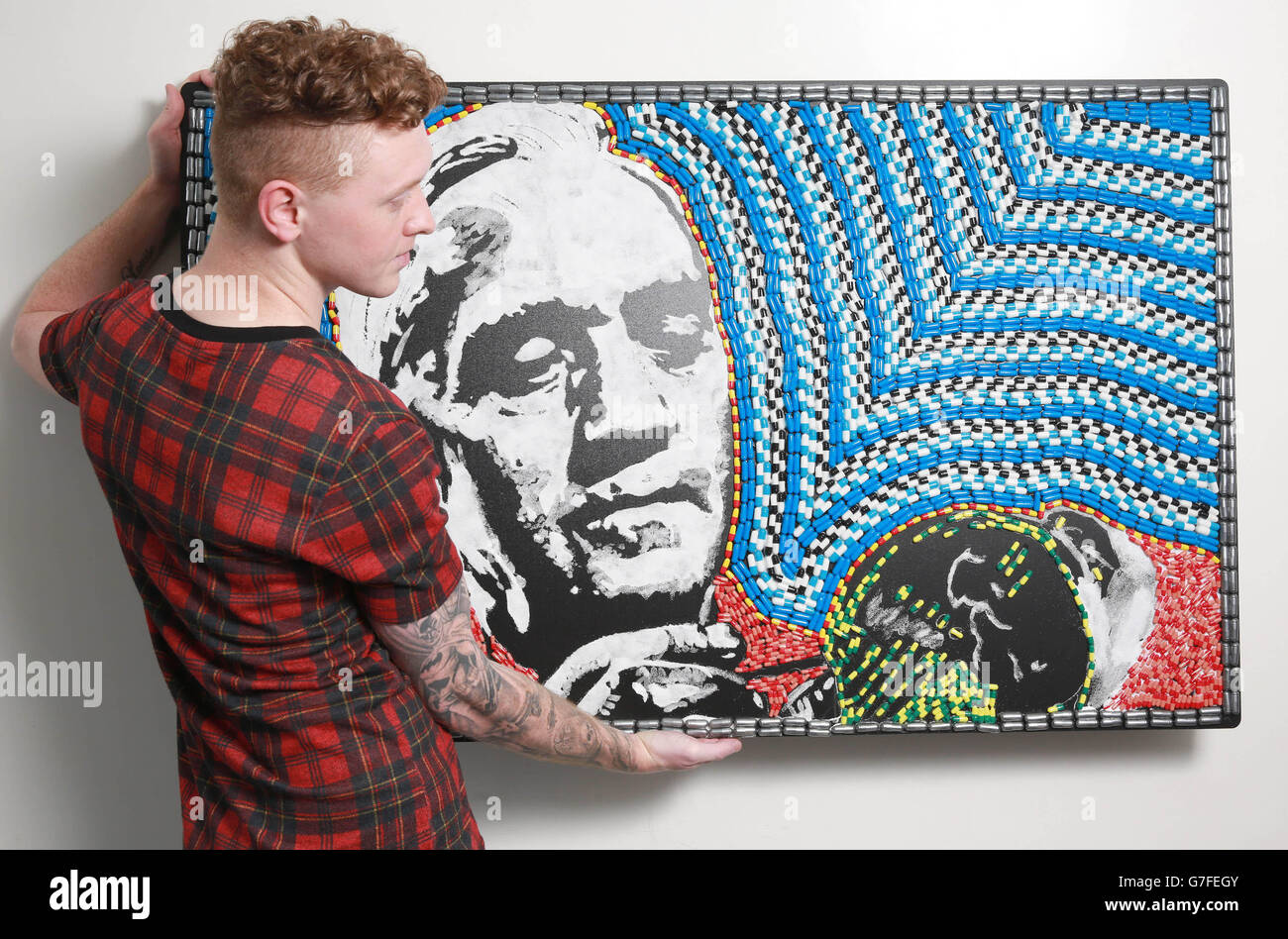Artist Nathan Wyburn uses empty drug capsules and powder to create a portrait of Alexander Fleming, best known for his discovery of penicillin, to mark the opening of Longitude Prize on European Antibiotic Awareness Day. Stock Photo
