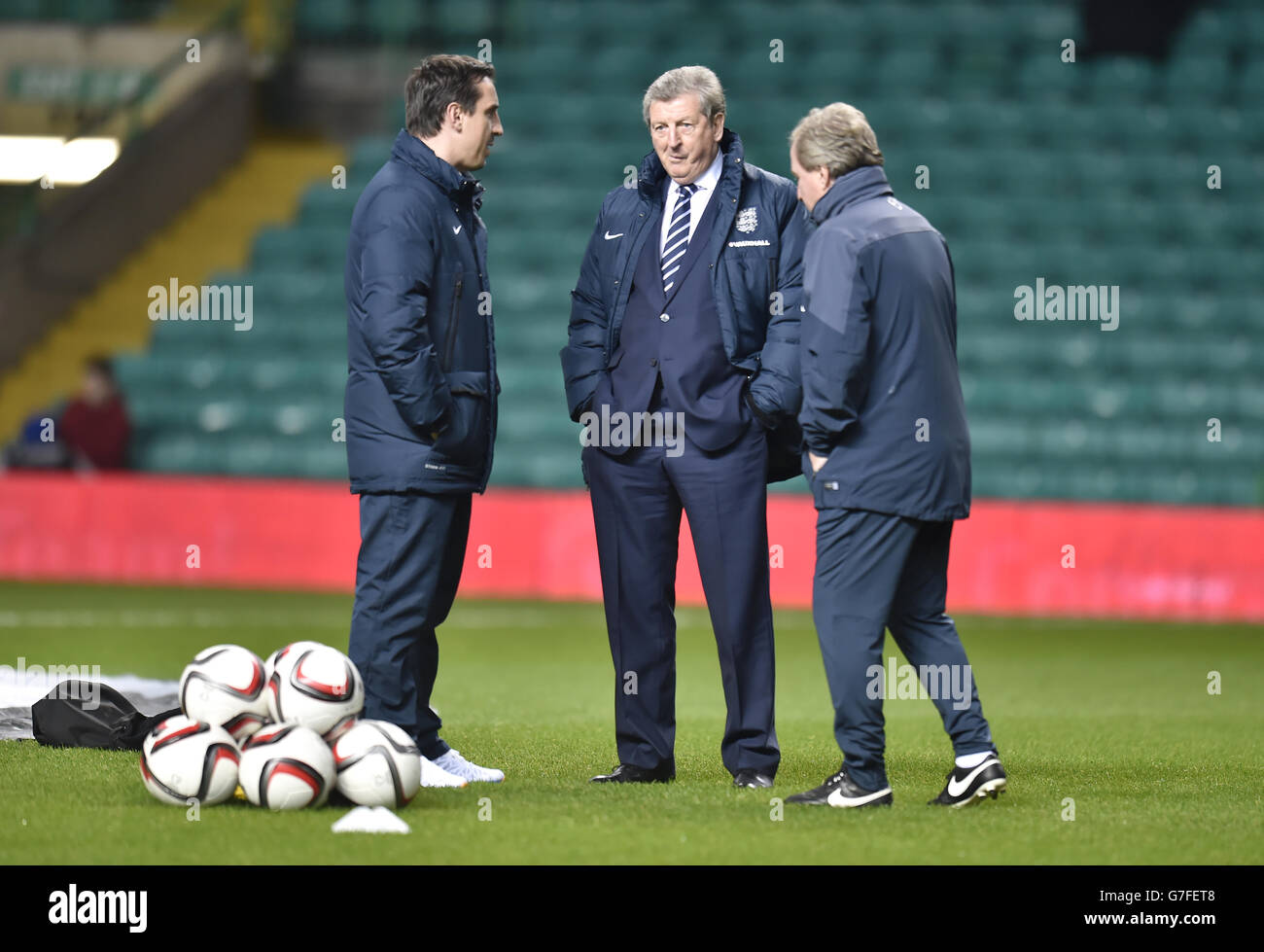 England manager Roy Hodgson (centre), assistant manager Ray Lewington (right) and coach Gary Neville before the International friendly at Celtic Park, Glasgow. PRESS ASSOCIATION Photo. Picture date: Tuesday November 18, 2014. See PA Story SOCCER Scotland. Photo credit should read: Owen Humphreys/PA Wire. Stock Photo