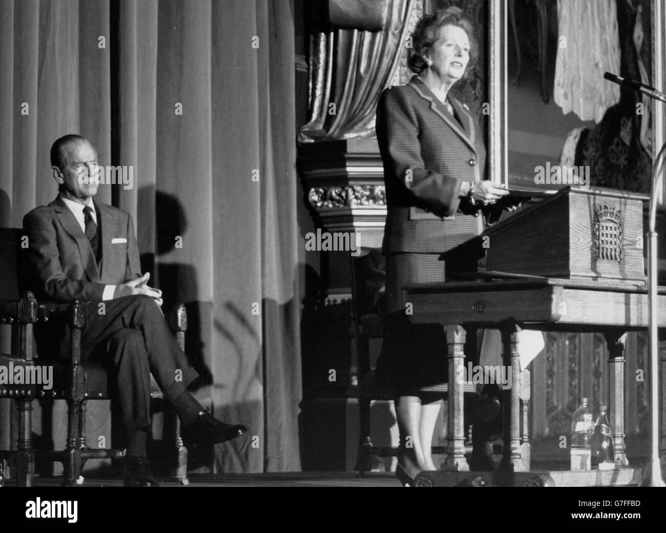 The Prime Minister, Margaret Thatcher, delivering the Parliamentary and Scientific Committee's 50th anniversary lecture in the Lords. Listening is the Duke of Edinburgh, who presided. *Scanned low-res from print, high-res available on request* Stock Photo