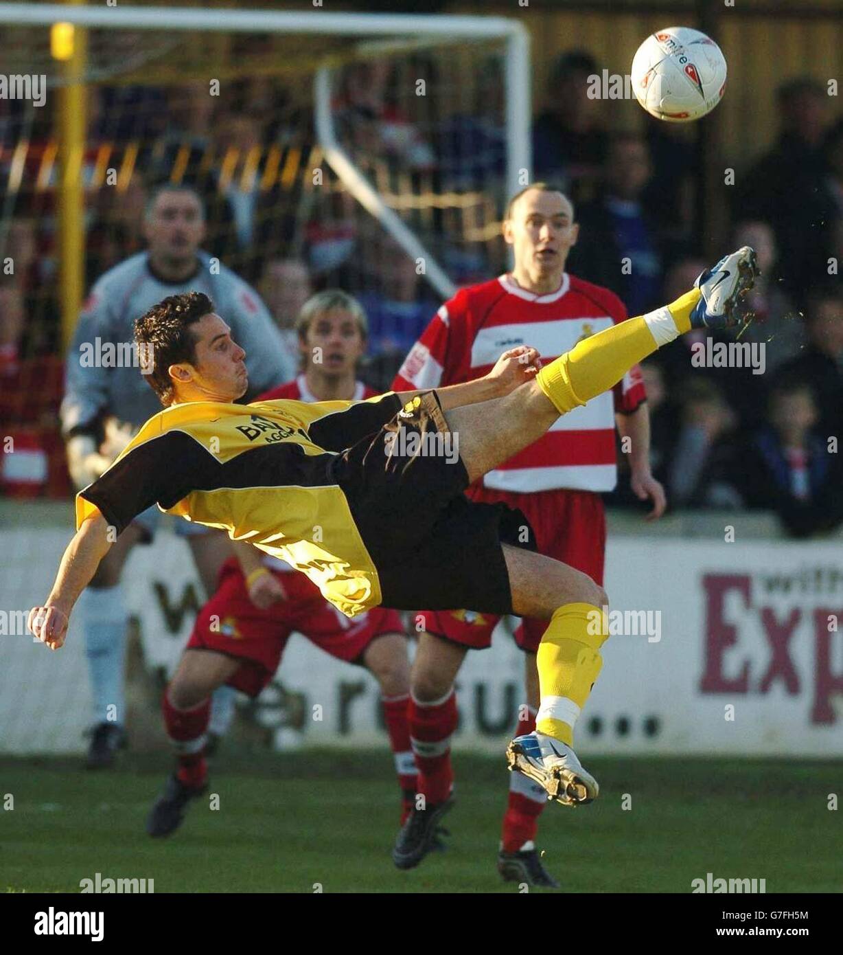 James Mudge of Tiverton fires a shot at the Doncaster goal during the FA Cup First Round match at Ladysmead, Bolham Road, Tiverton, Saturday November 13, 2004. NO UNOFFICIAL CLUB WEBSITE USE. Stock Photo