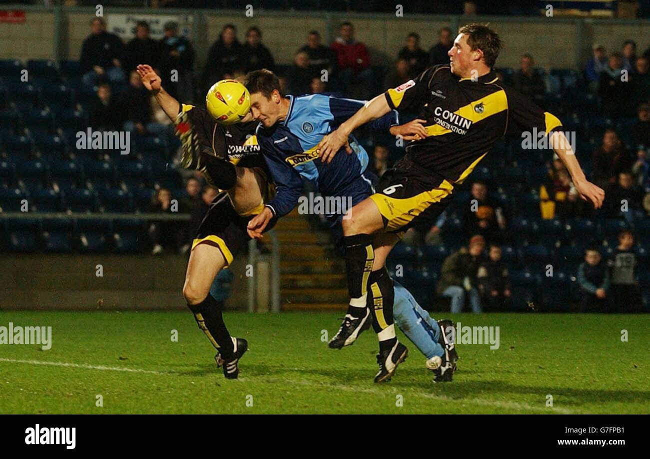 Wycombe's Ian Stonebridge dives through the Bristol Rovers defence to send a header narrowly wide, during the Coca-Cola League Two match at The Causeway Stadium, High Wycombe, Saturday November 27, 2004. NO UNOFFICIAL CLUB WEBSITE USE. Stock Photo
