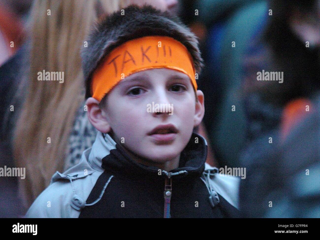 A young Ukrainian joins others from across Britain to gather at the Ukrainian Embassy in London's Holland Park to show their support for support opposition candidate for, Viktor Yuschenkoc and the escalating political crising in their home country. Stock Photo