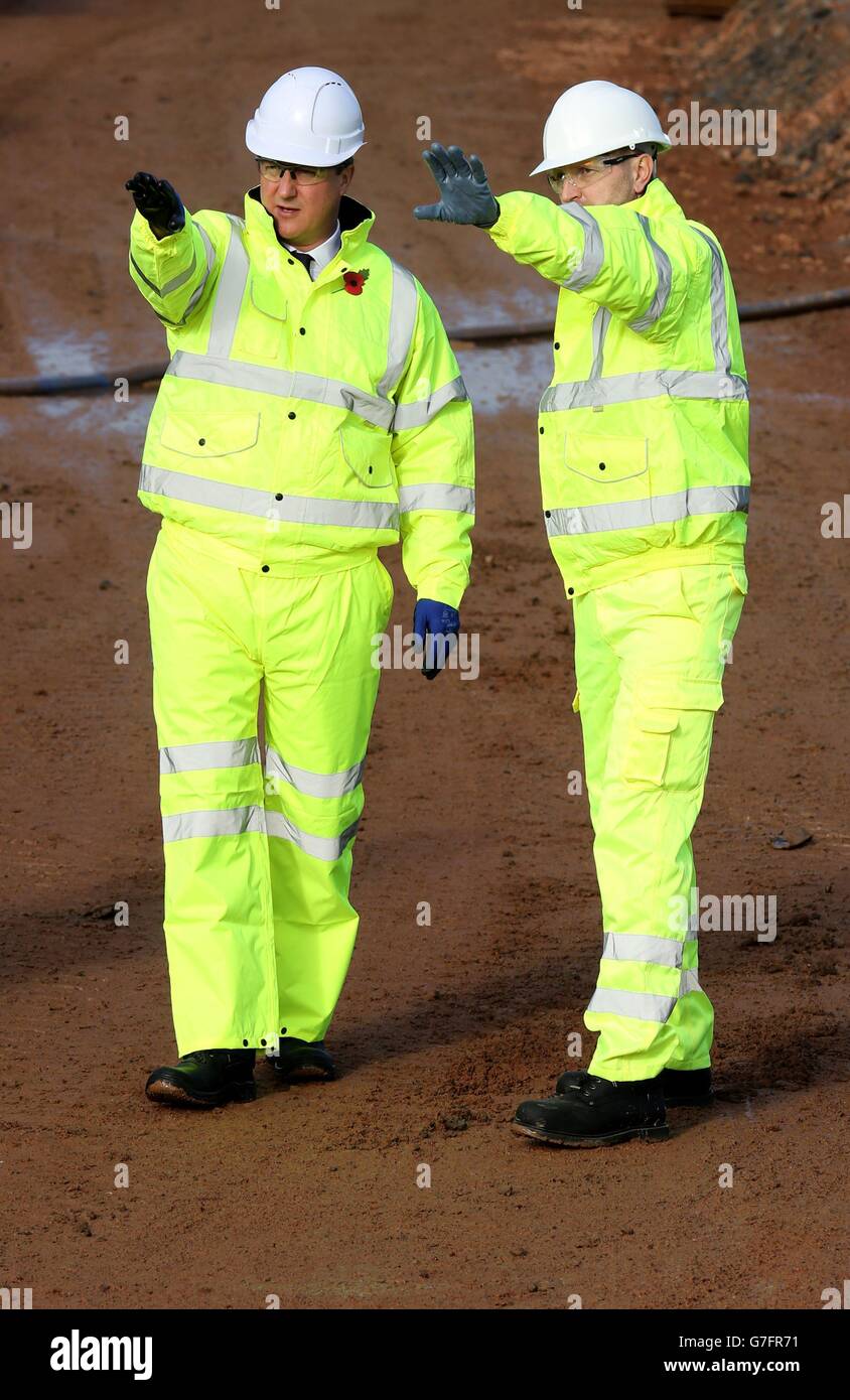 Prime Minister David Cameron (left) during a tour of construction works underway at Cat Thorpe interchange at Swinford in Rugby Warwichshire. Stock Photo