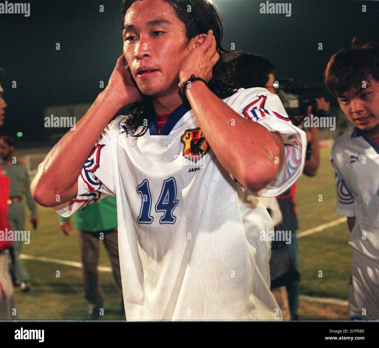 Japan's Masayuki Okano leaves the field after losing to Kuwait and being knocked out of the tournament Stock Photo