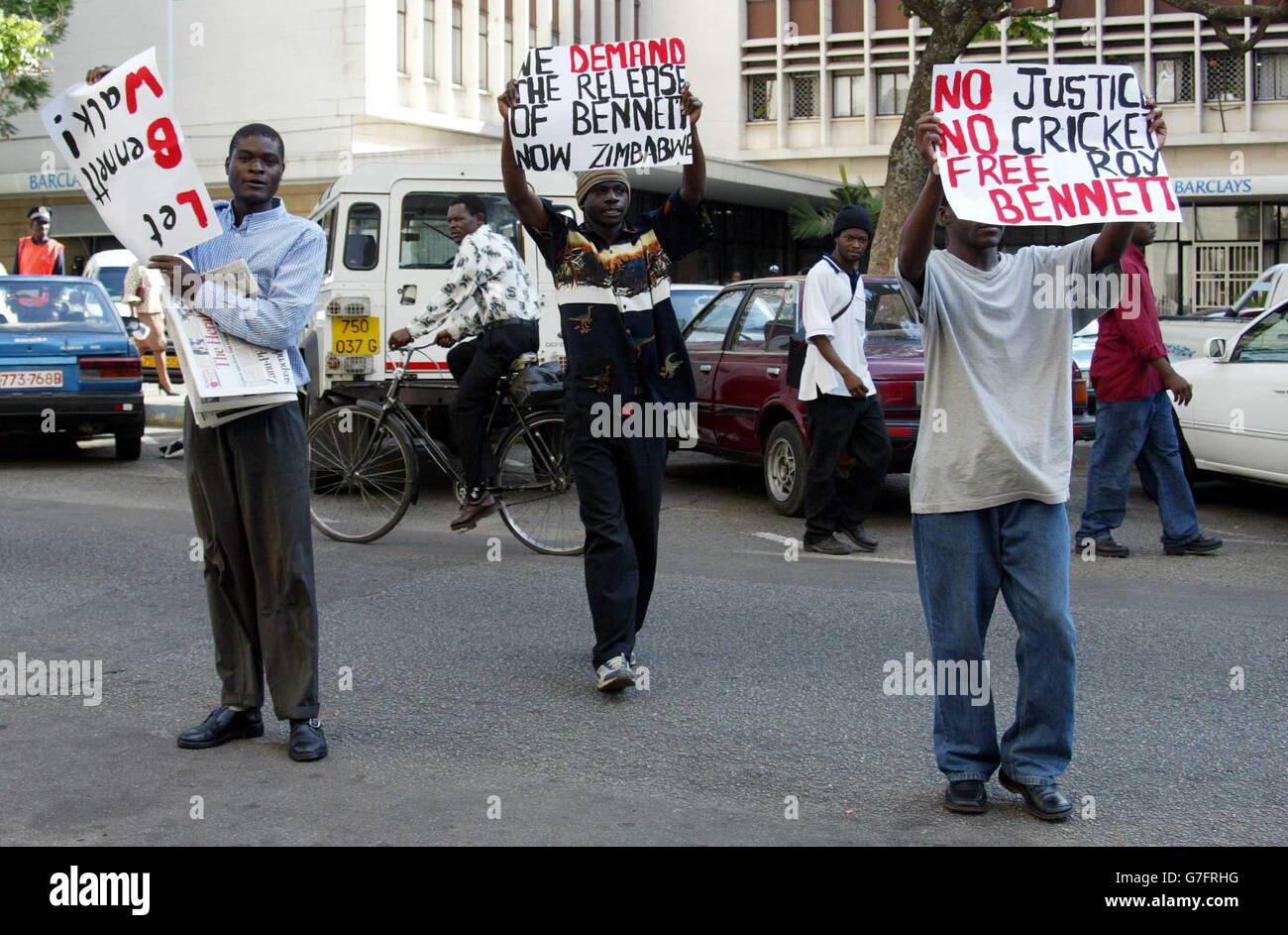 Protesters stage a small demonstration outside the hotel of the England cricket team in Harare as the players leave to prepare for the second match of their one-day series against Zimbabwe. The demonstrators carried placards demanding the release of imprisoned opposition MP Roy Bennett who is serving a one year jail sentence for assaulting a minister in parliament. Stock Photo