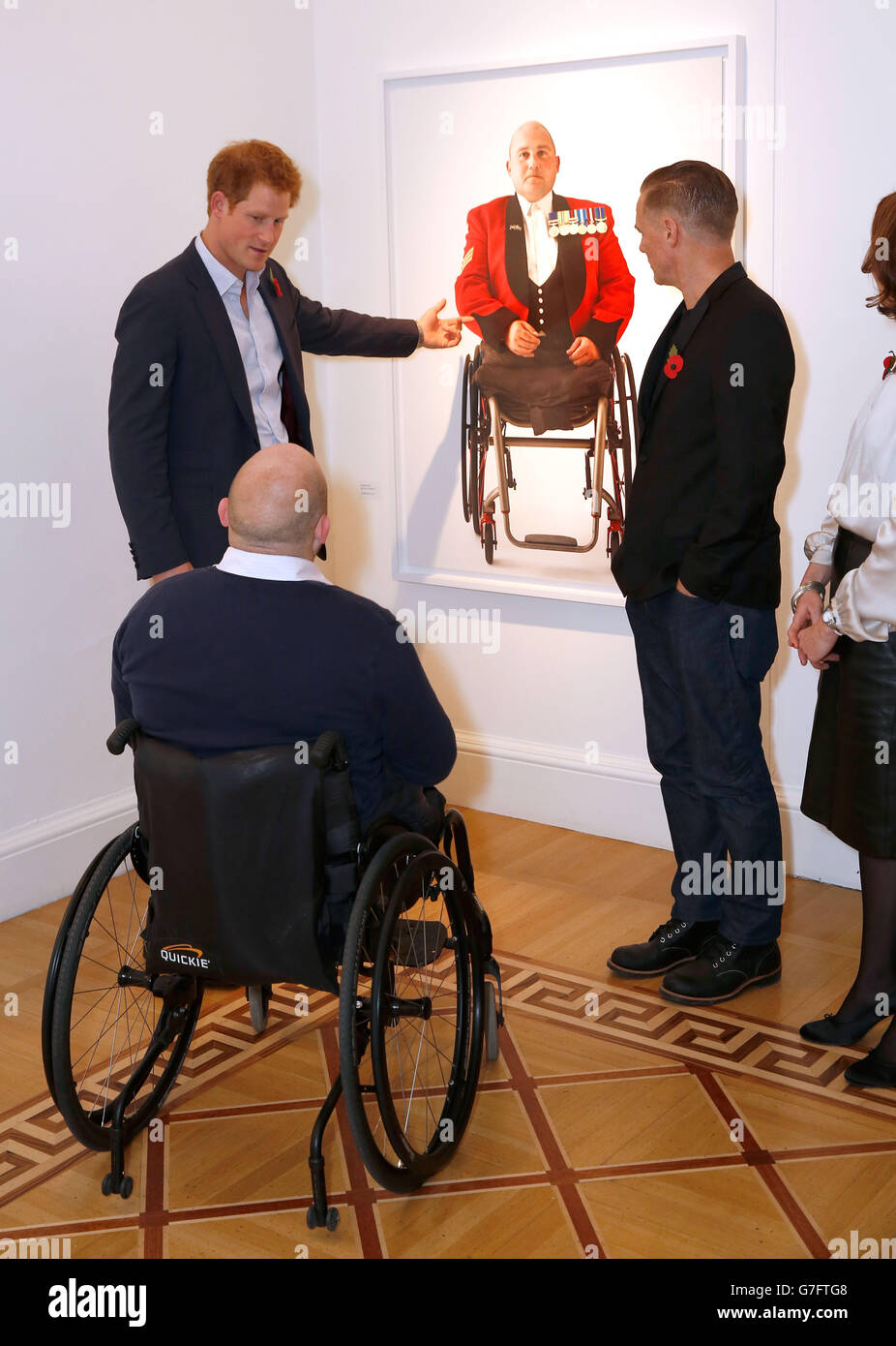 Prince Harry talks to Rick Clement and singer turned photographer Bryan