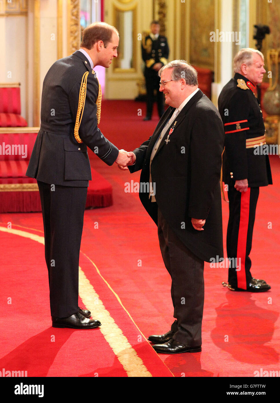 Jonathan Ullmer, from Westcliff-On-Sea, is made an MBE by the Duke of Cambridge during an investiture ceremony at Buckingham Palace, London. Stock Photo