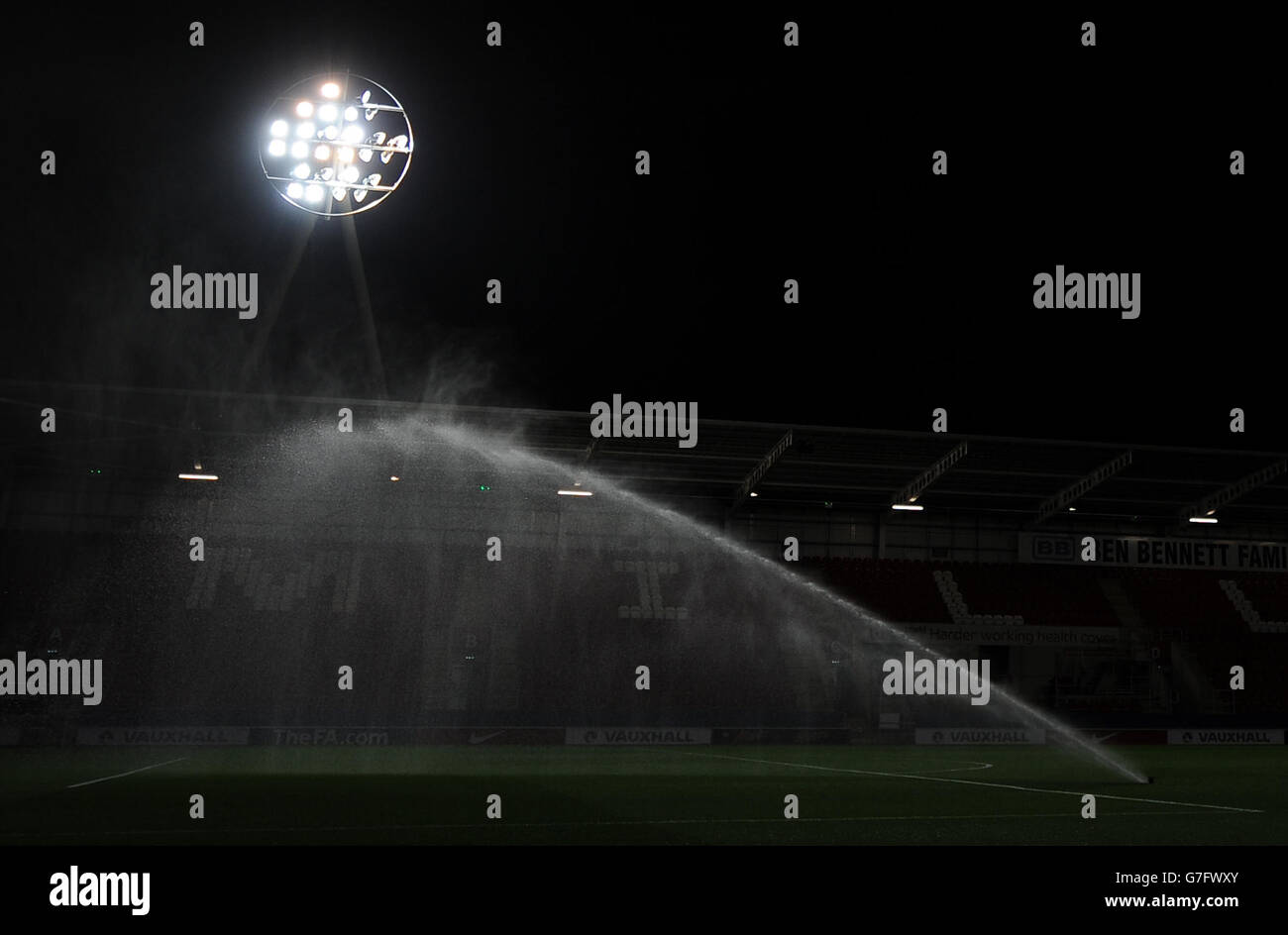 The pitch being watered under floodlights at the New York Stadium