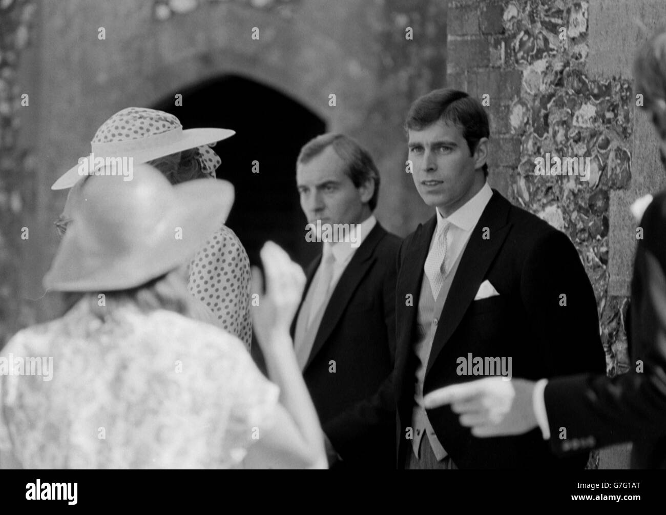 1985: Prince Andrew (right) at Highclere, Berkshire, where he was attending the wedding of the Hon. Carolyn Herbert to bloodstock agent John Warren. To the left is the Princess of Wales' police bodyguard, Barry Mannakee. Stock Photo