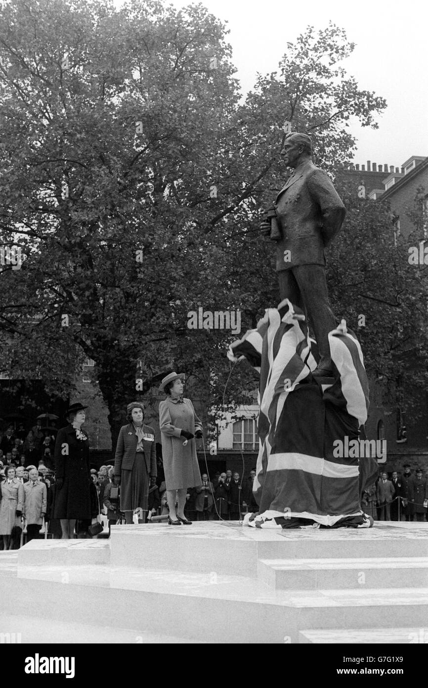 Queen Elizabeth II unveils a statue of Earl Mountbatten of Burma on the Foreign Office Green in