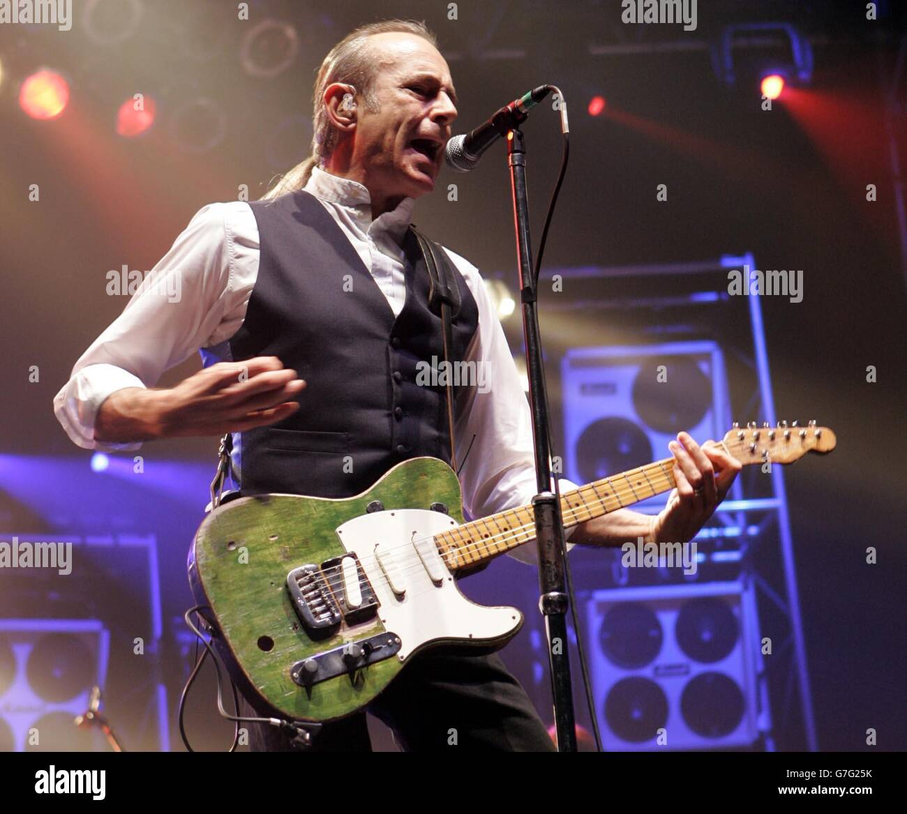 Guitarist Francis Rossi from the rock group Status Quo on stage, during their concert at Wembley Arena in London. Stock Photo