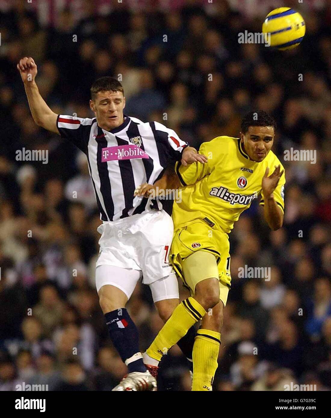 West Bromwich Albion's Jason Koumas (left) rises with Charlton's Jerome Thomas during the Barclays Premiership match at The Hawthorns, West Bromwich, Saturday December 11, 2004. Stock Photo