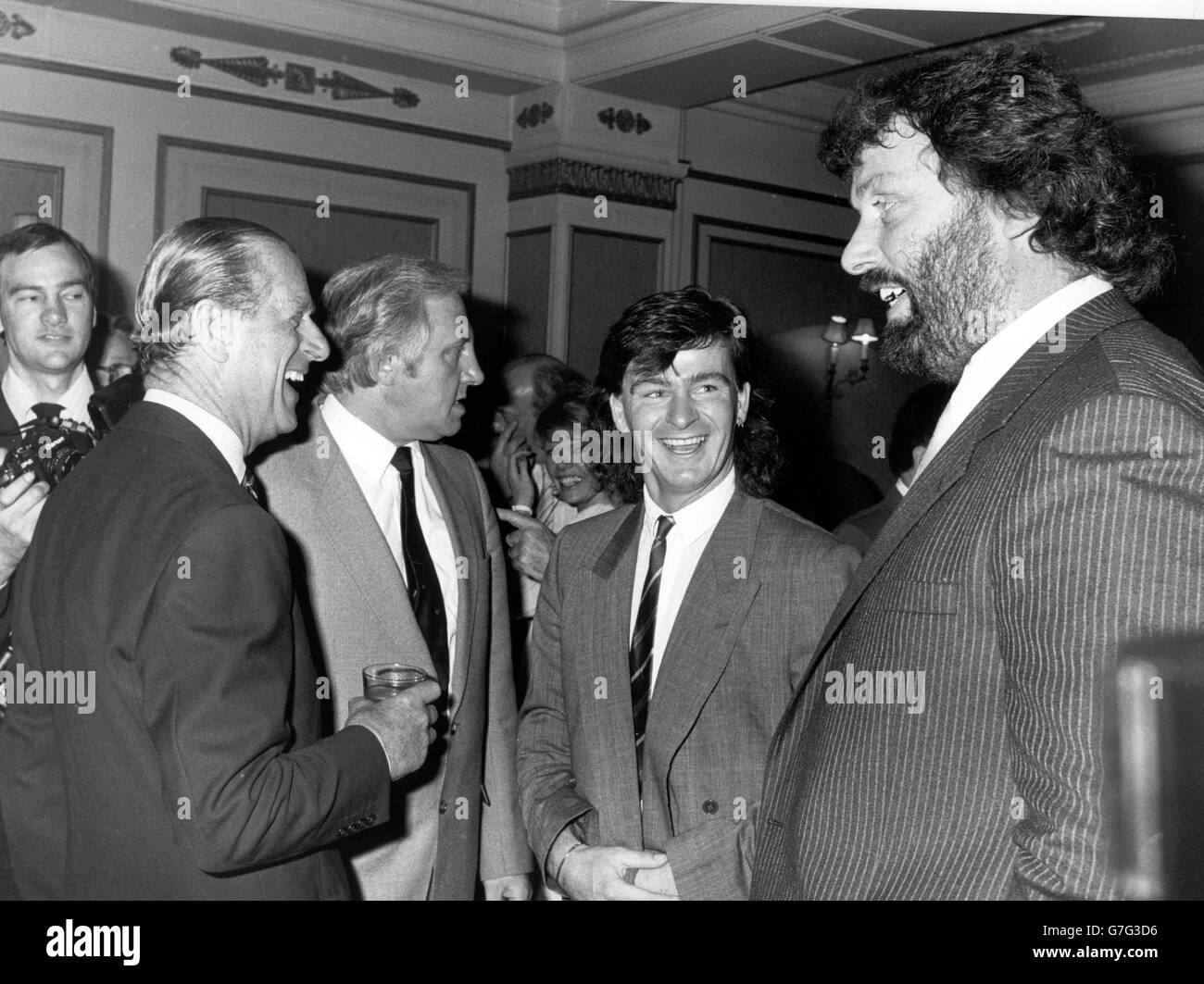The Duke of Edinburgh at the National Sponspored Sports luncheon, organised by The Variety Club of Great Britain, at the Cafe Royal, London. The Duke enjoys chatting with (l-r) strongman Geoff Capes and footballer Charlie Nicholas. *Scanned low-res from print, high-res available on request* Stock Photo