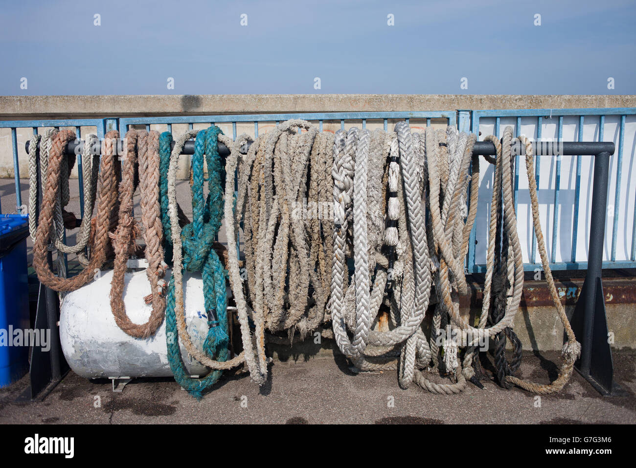 Anchor ropes, mooring lines, old, aged, weathered marine equipment in