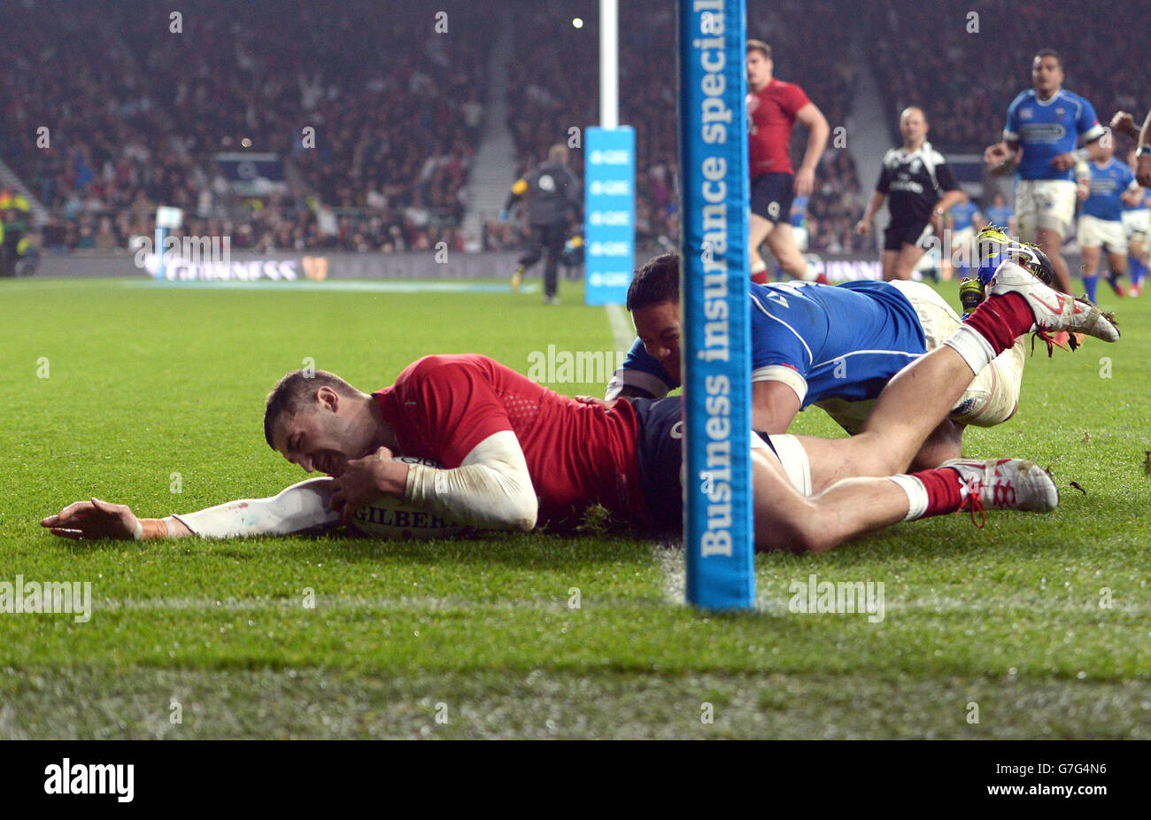 England's Jonny May scores his second try during the QBE International match at Twickenham, London. Stock Photo